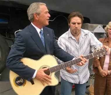 Bush playing guitar