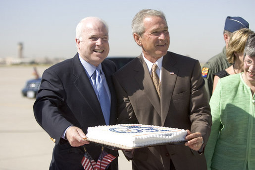 Bush and McCain laughing over birthday cake