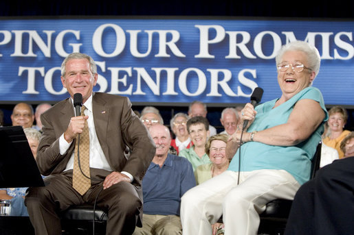 Bush laughing with senior citizen