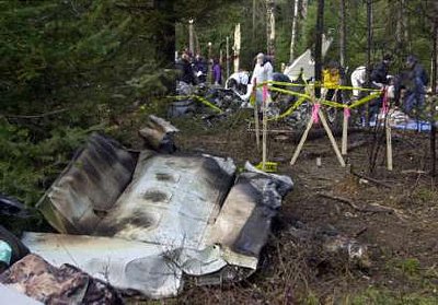 Investigators pore over the wreckage of the Wellstone plane crash