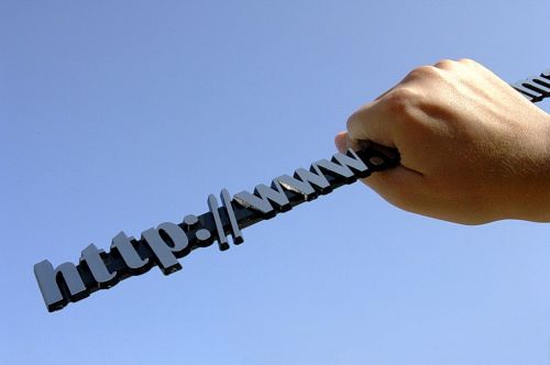 hand clutching a domain name hand clutching a domain name