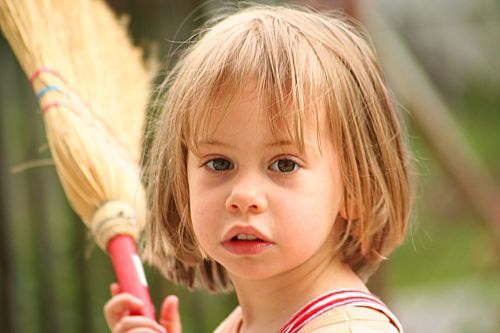 little girl with broom